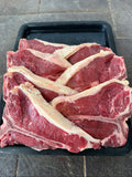 Fresh T-bone steaks on a black tray, hand-cut at Fehst on Meats Maffra